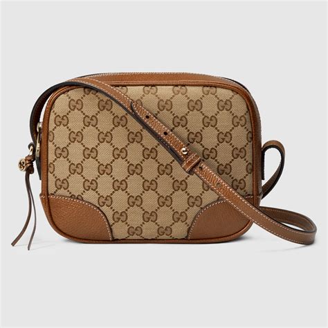 marchio gucci con armatura borsa tessuto lucido|borse Gucci stile.